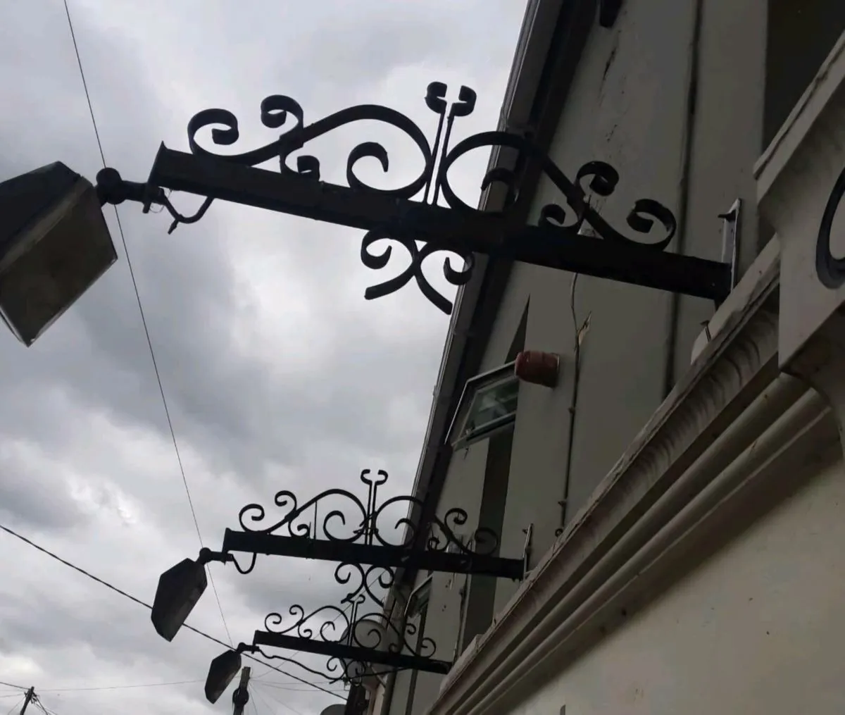 Light outdoor iron brackets and shop front - Image 3