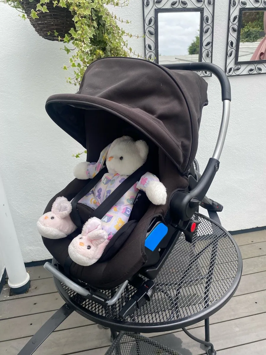 A Silver Cross Travel System Car Seat - Image 1