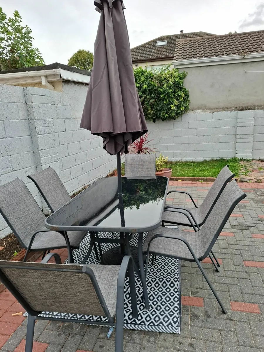 Outdoor table, chairs and umbrella - Image 1