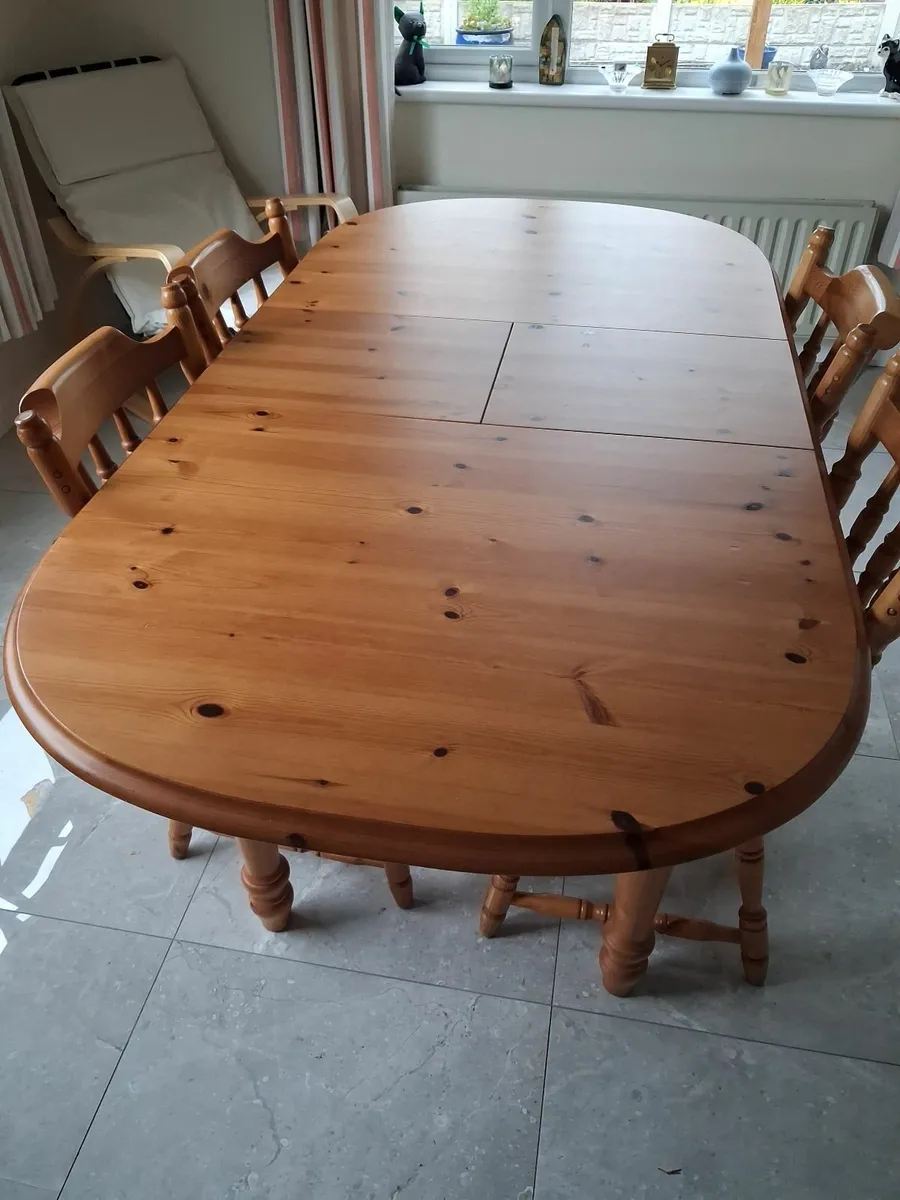 Solid pine dining table with 4 chairs.