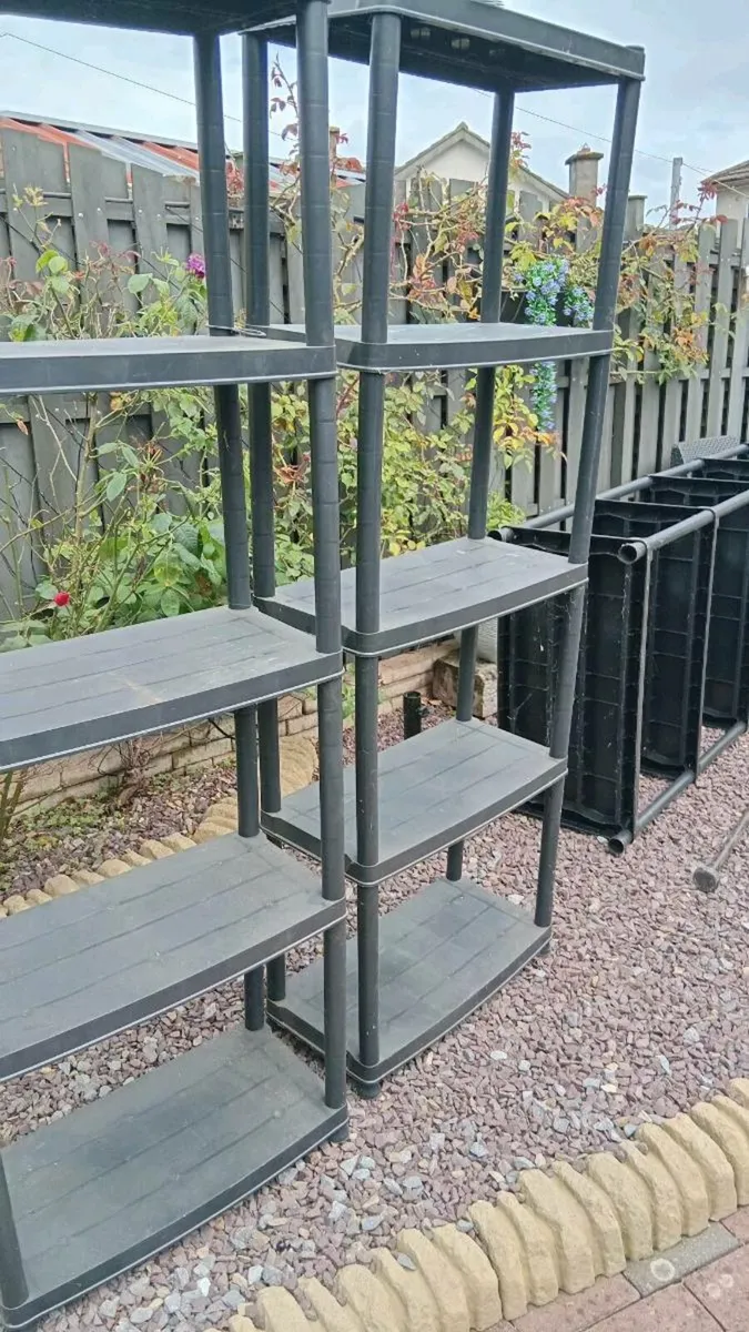 2 plastic shelving units