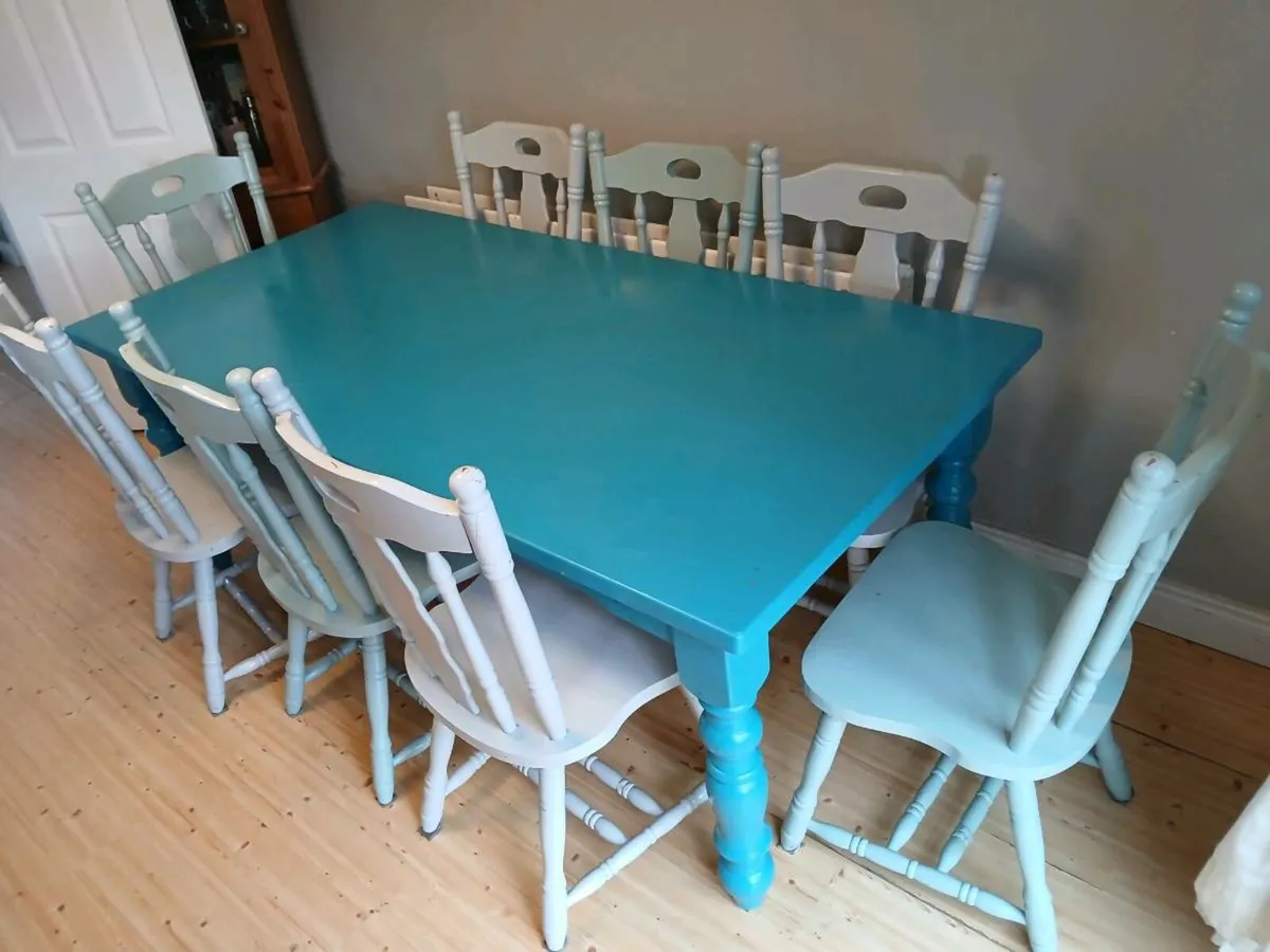 SOLID WOODEN TABLE AND 8 CHAIRS - Image 1