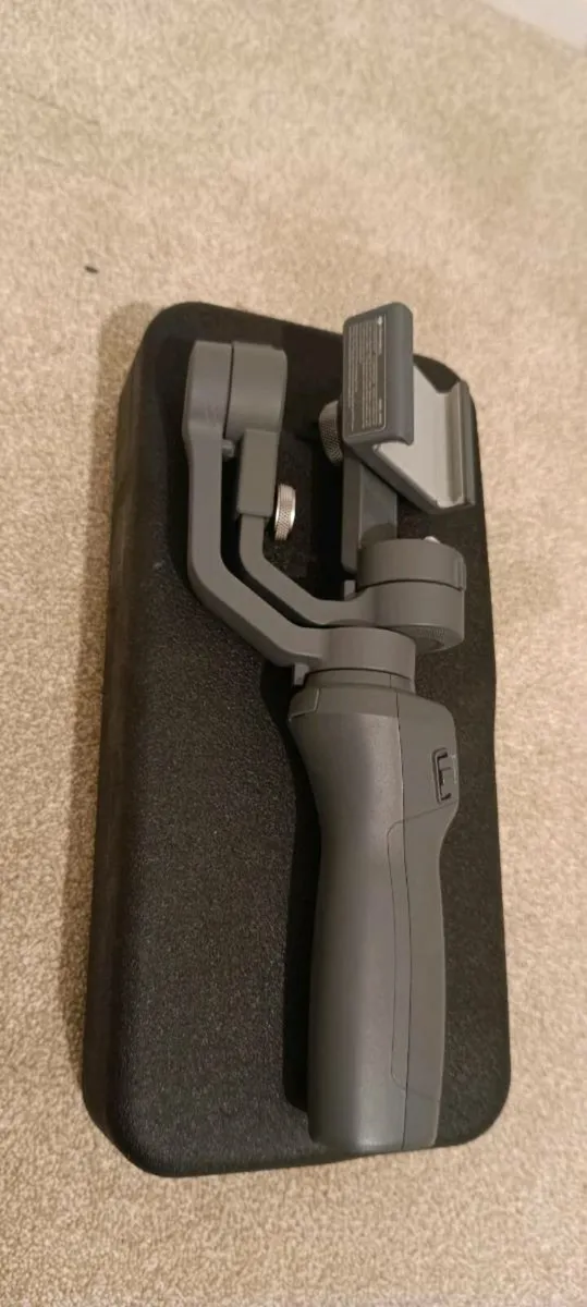 DJI Osmo Mobile 2 camera gimbal and case for sale. - Image 1