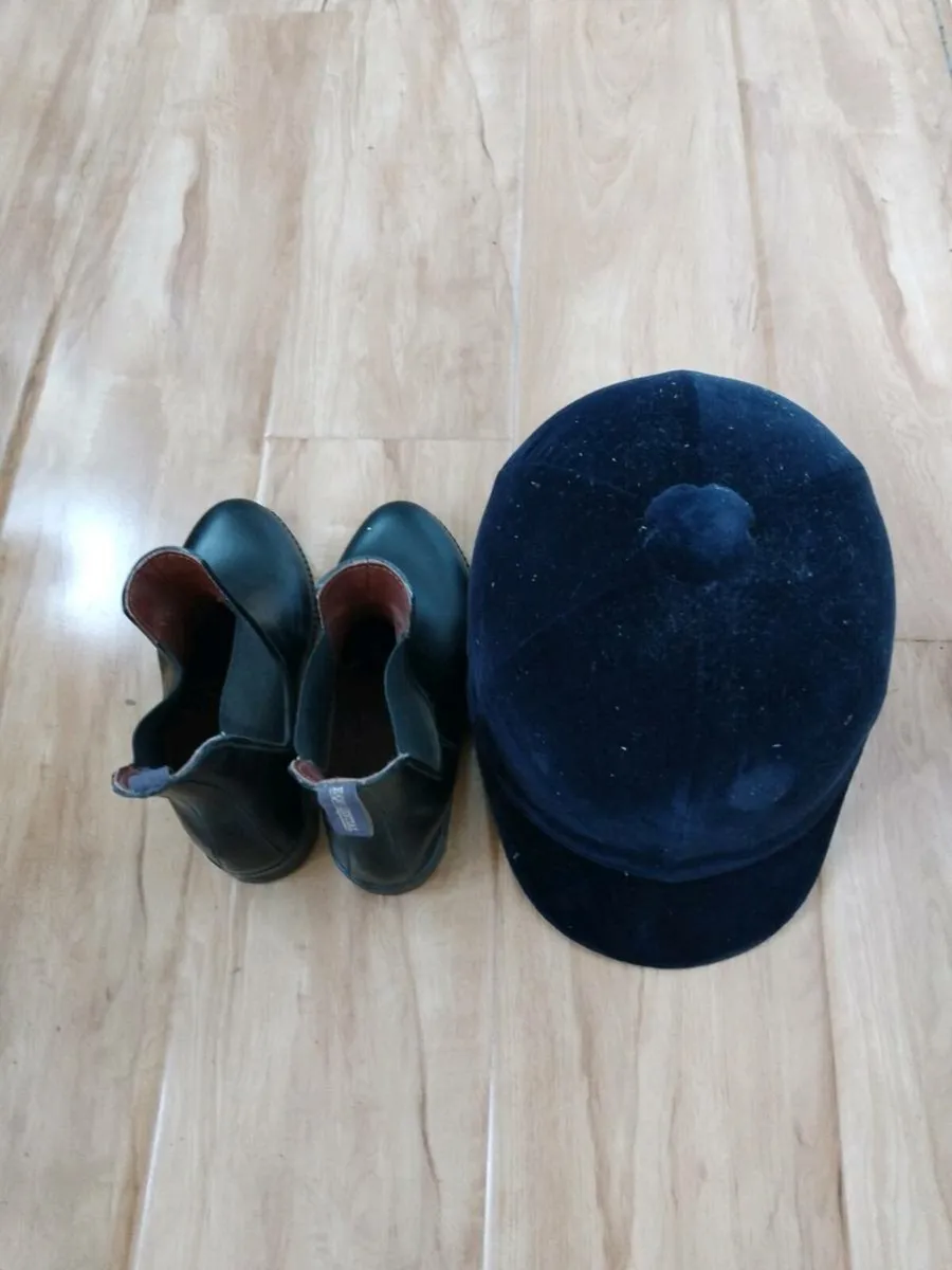 Helmet and boots - Image 1