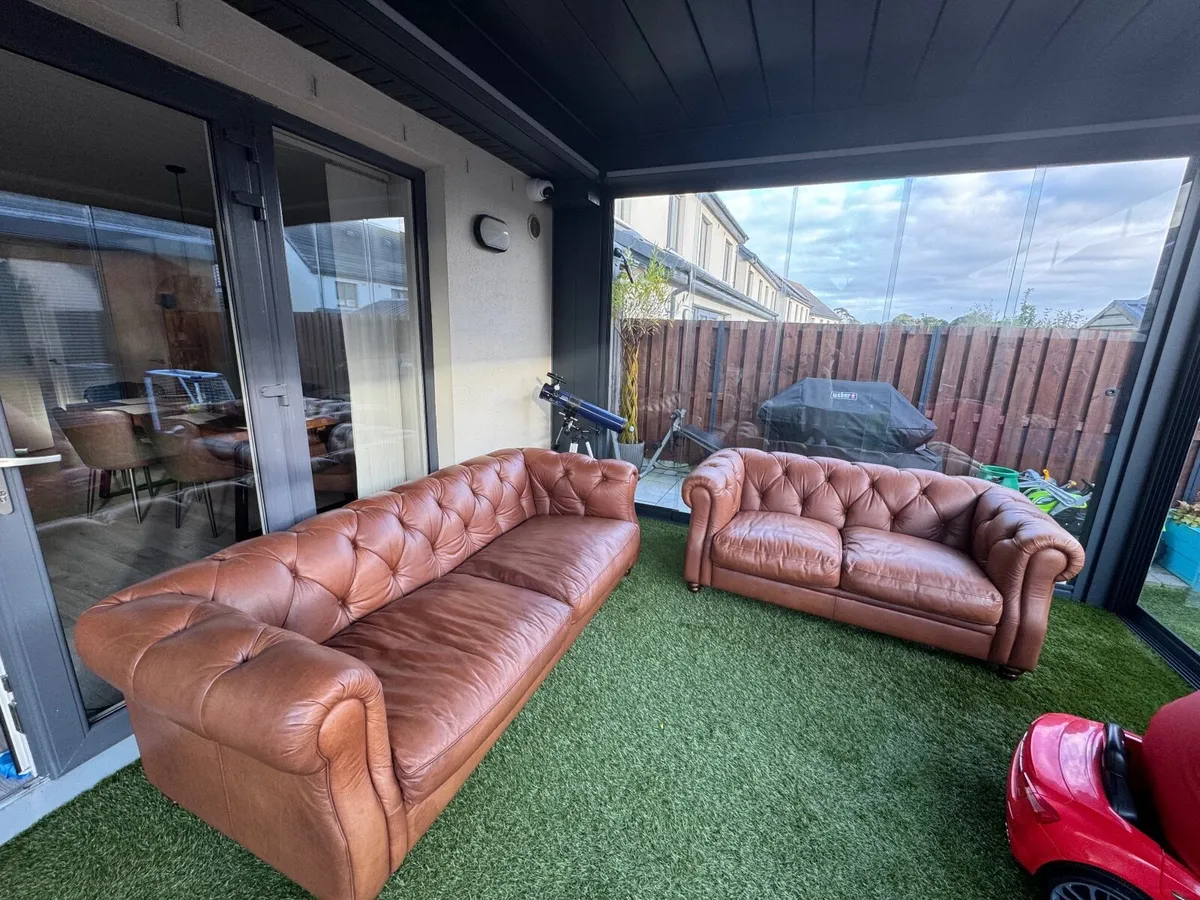 Real leather chesterfield sofas - Image 1