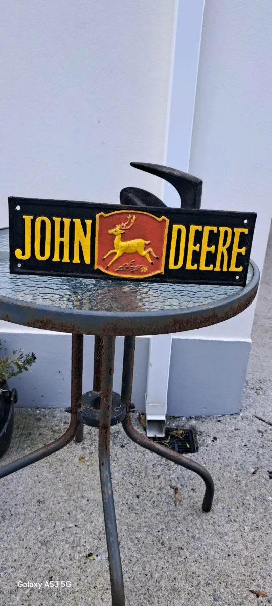 John deer cast iron sign