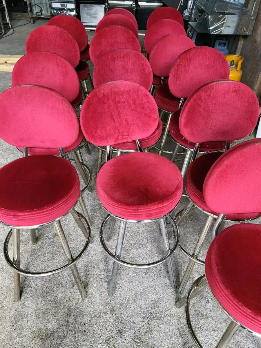 Cushioned swivel chairs with back rests