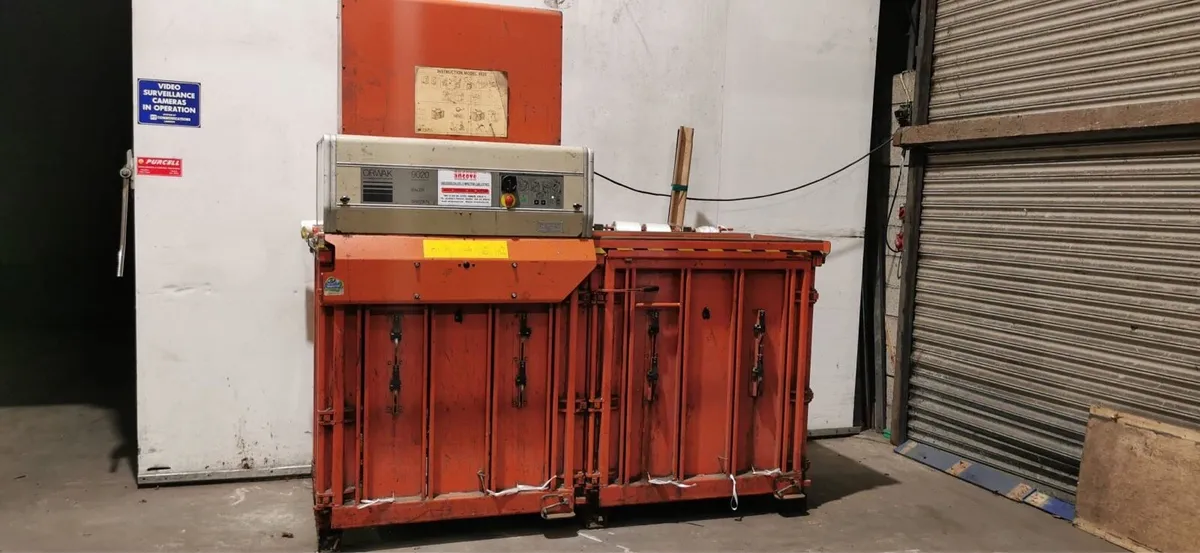 Cardboard and plastic dual bailer