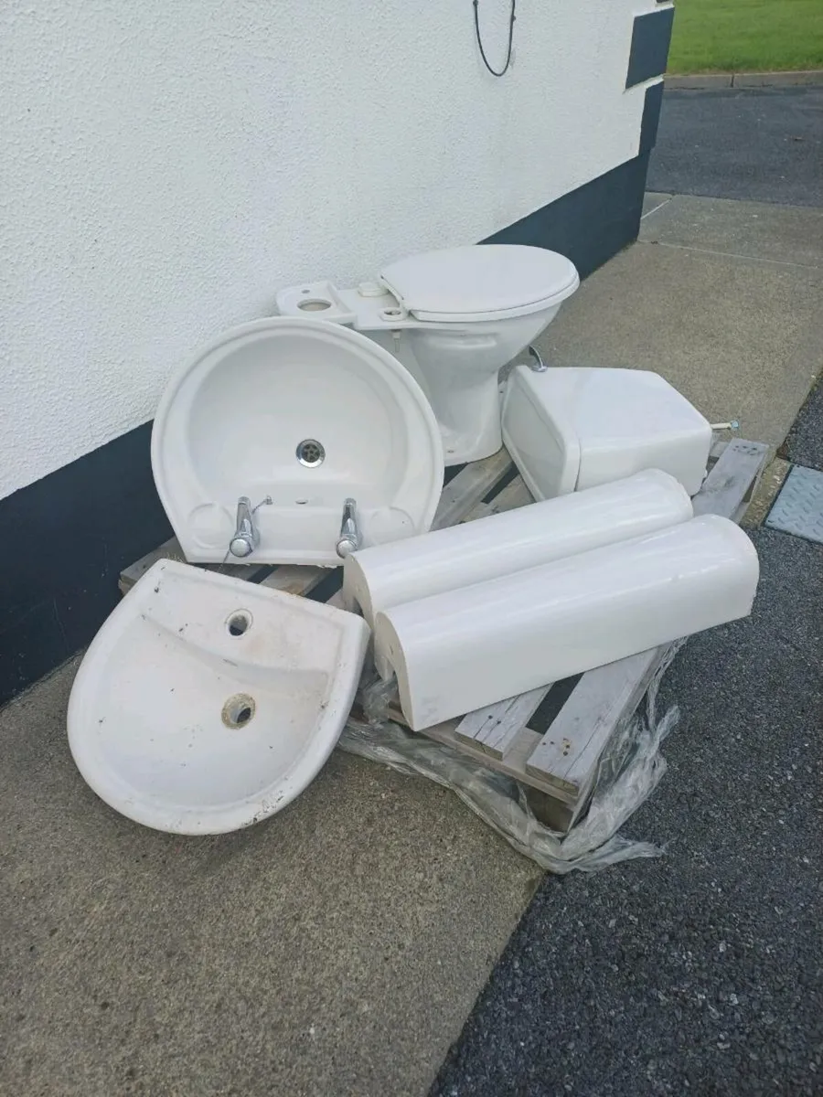 Toilet and two sinks