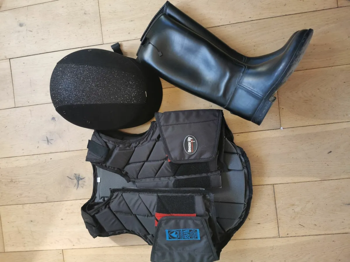 Equestrian vest, helmet and boots