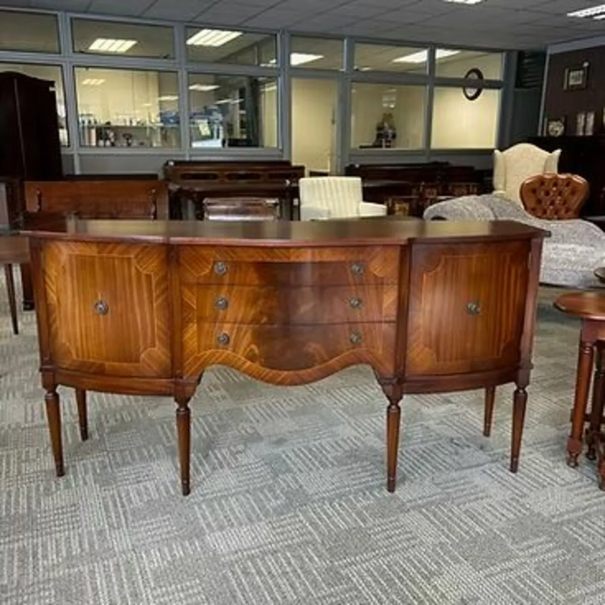 Beautiful mahogany serpentine sideboard. Enclosed