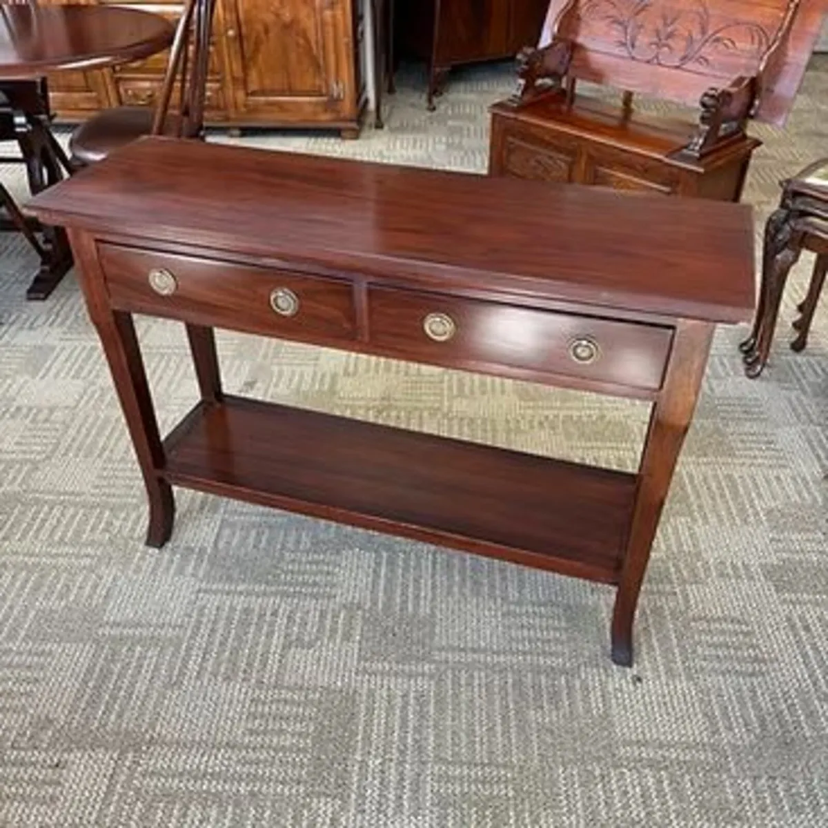 Beautiful mahogany two drawer tier console table.