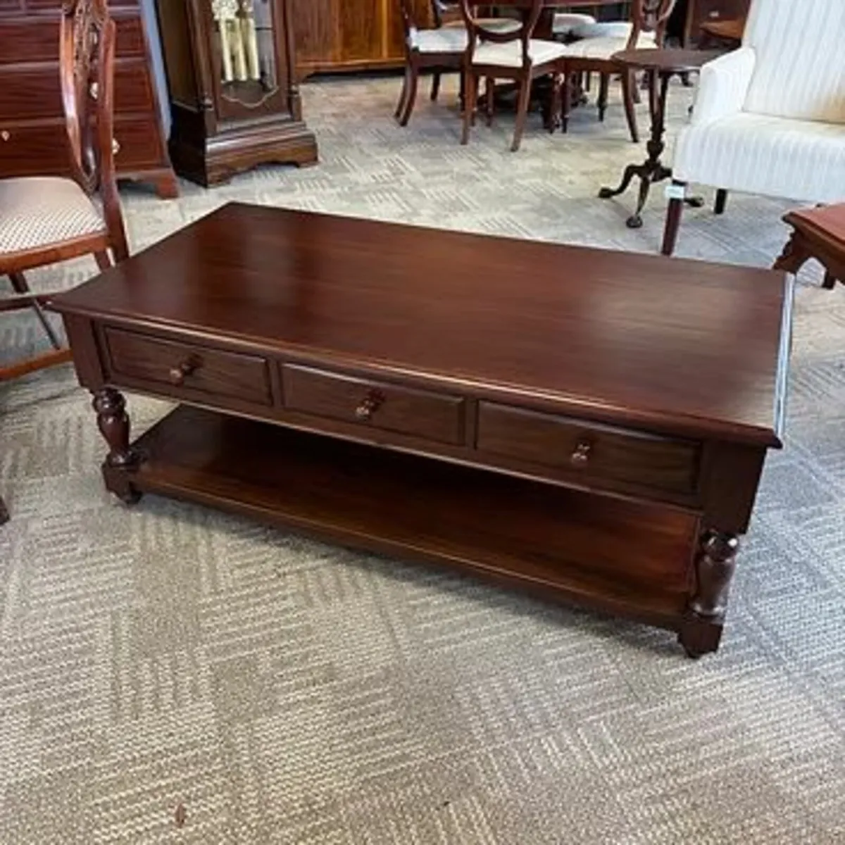 Beautiful mahogany three drawer tier coffee table.