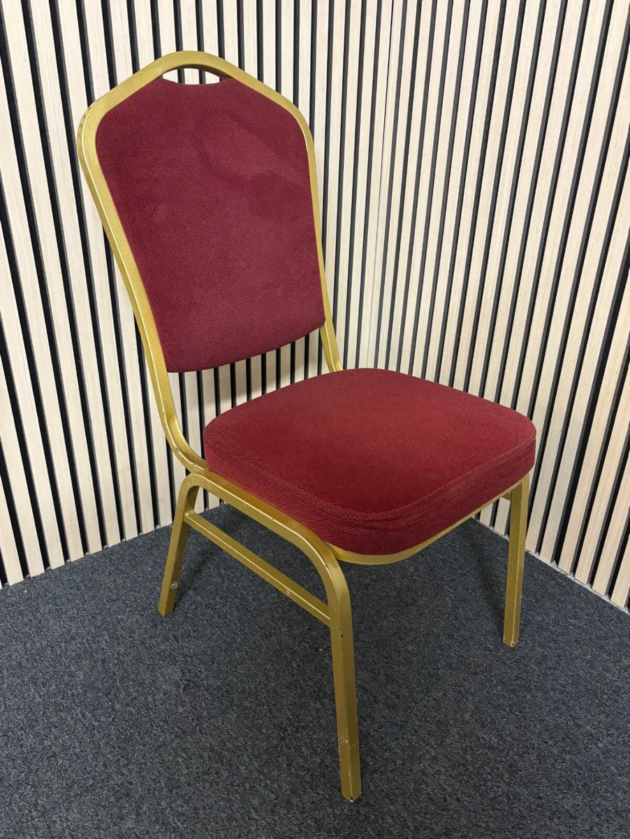 Solid metal framed red fabric banquet chair at CJM - Image 1