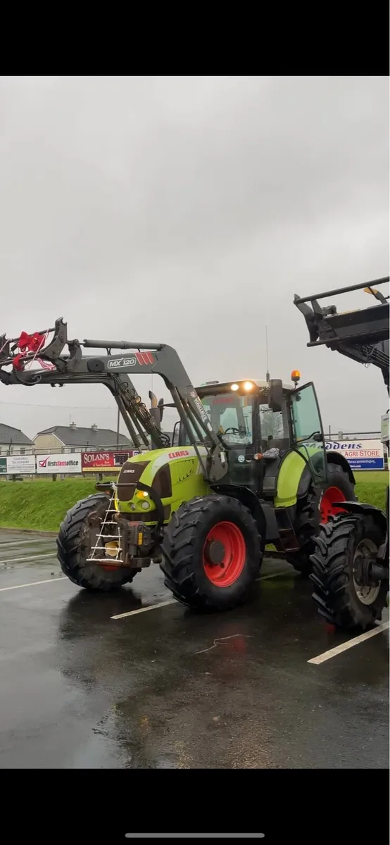 CLAAS ARION 640 with QUICKE front loader - Image 1