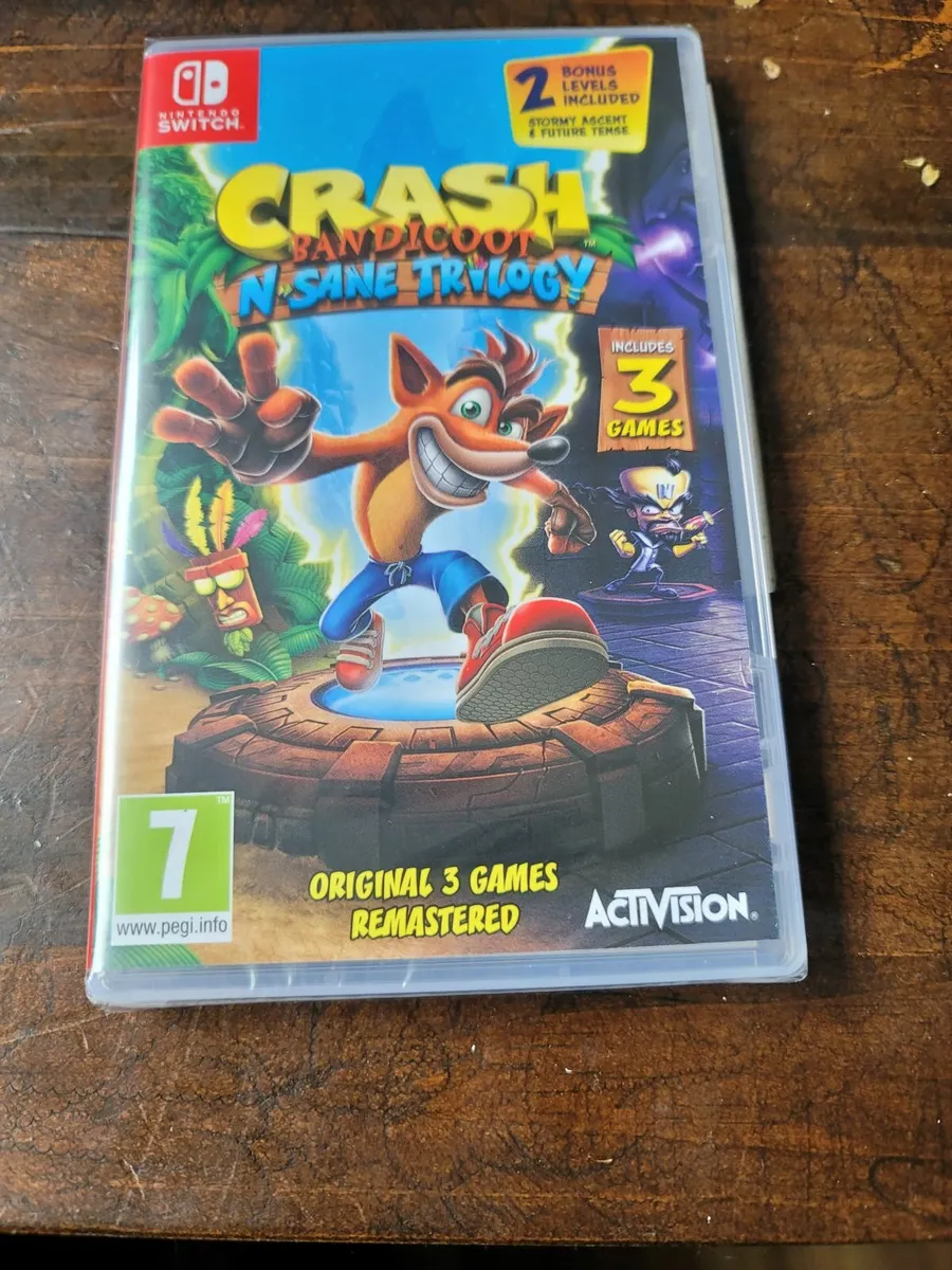 NINTENDO SWITCH AND 2 GAMES - Image 1