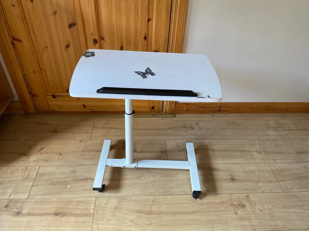 Over bed/chair adjustable table on wheels. - Image 1
