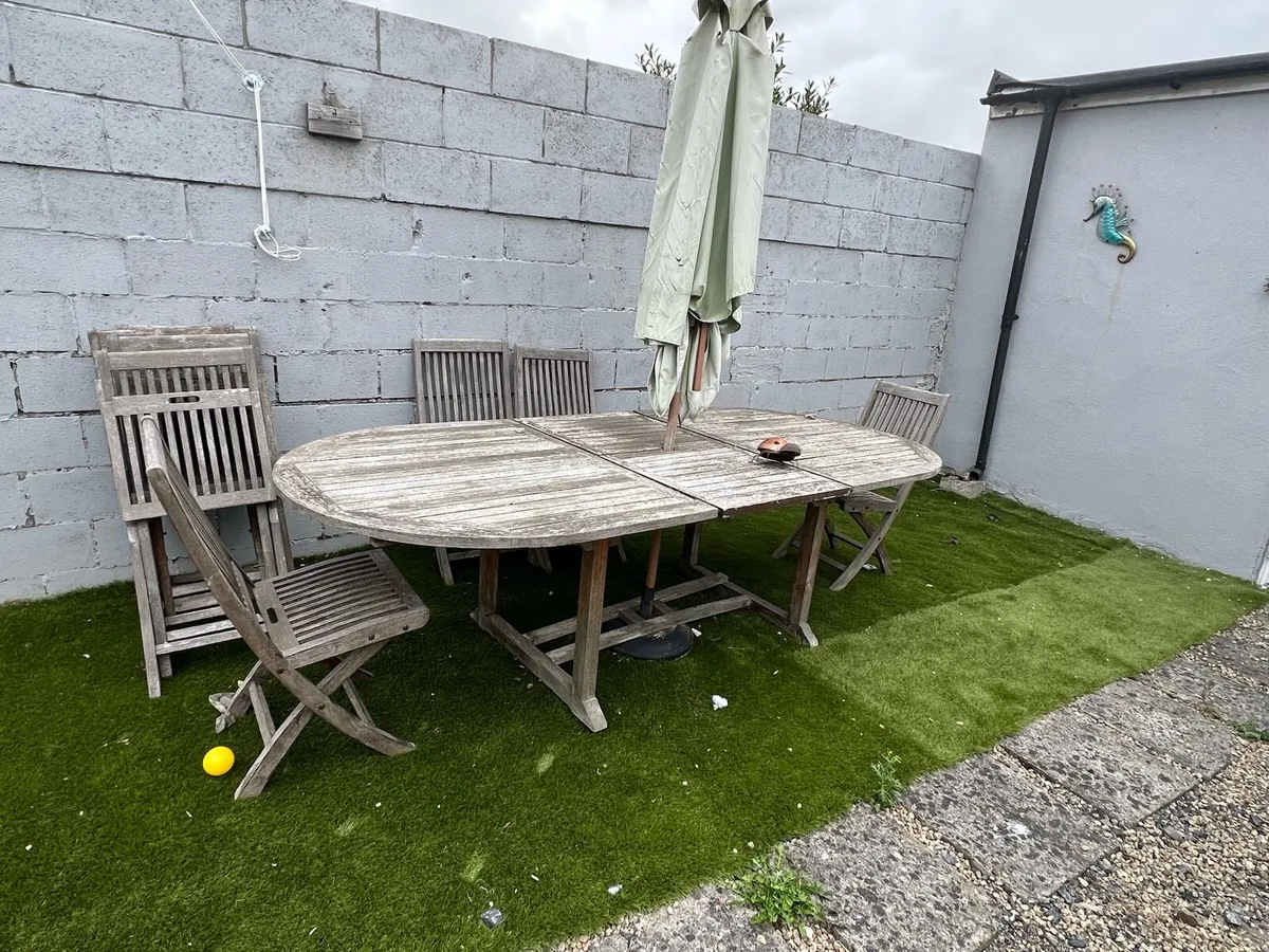 FREE-WOODEN GARDEN TABLE,8 CHAIRS & SUN UMBRELLA - Image 1