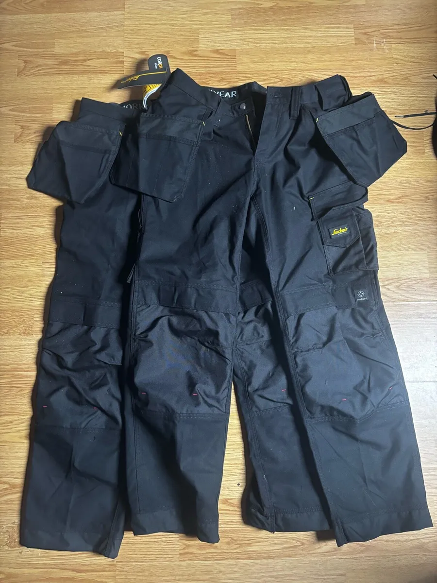 2 pairs of snickers workwear bottoms with flaps - Image 1