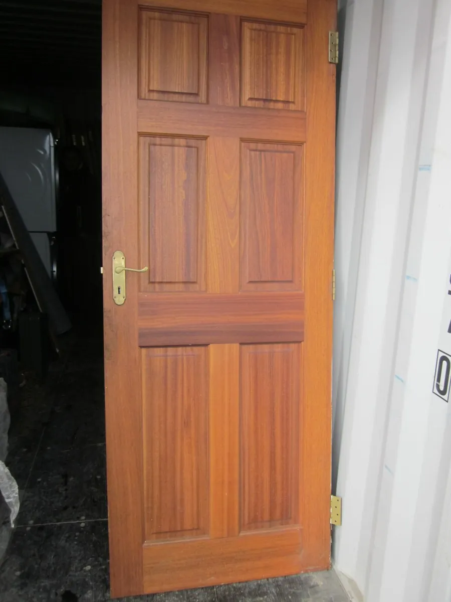 Pre-owned twelve hard wood unglazed doors with six - Image 1