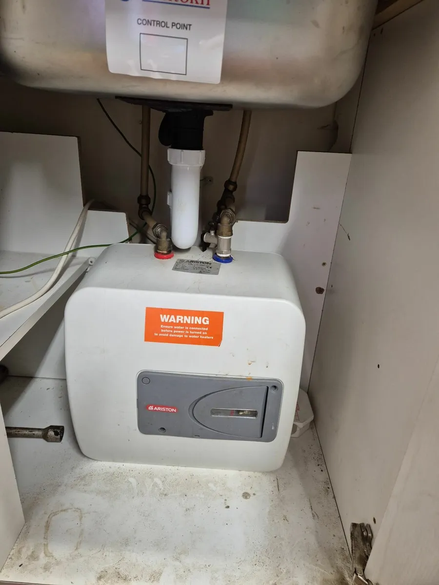 Sink and water heater with fittings - Image 1