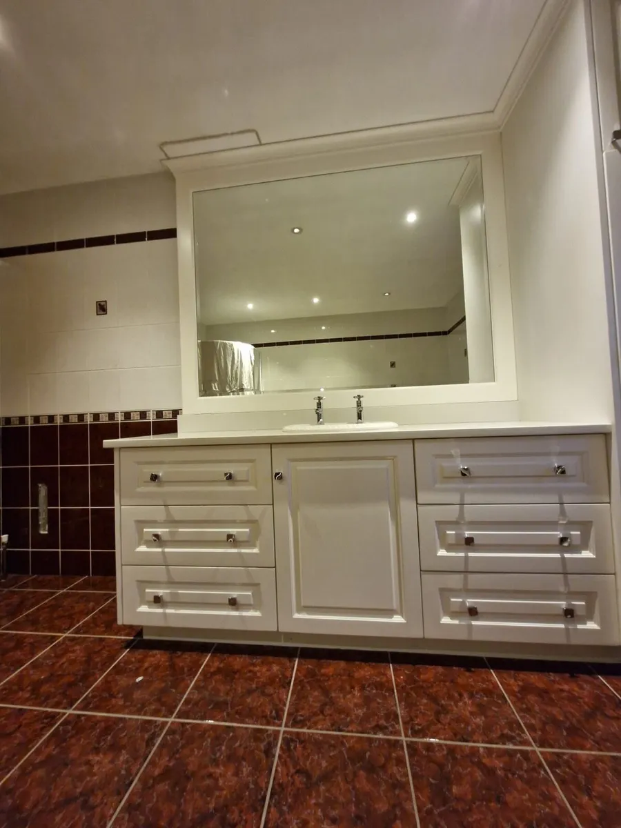 Bathroom Vanity and Corner Bathtub - Image 1