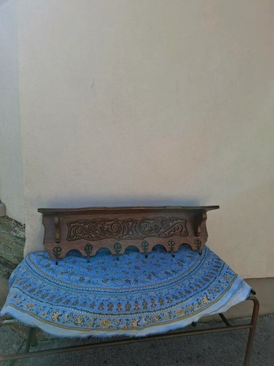 Old wood engraved coat holder