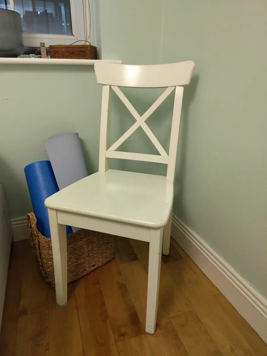 Two white wooden chairs