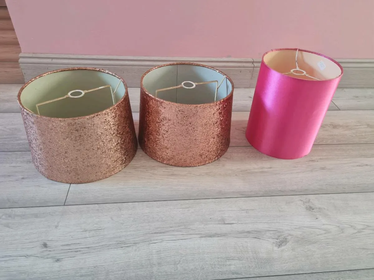 2 glitter lamps shades and 1 bright pink small 1