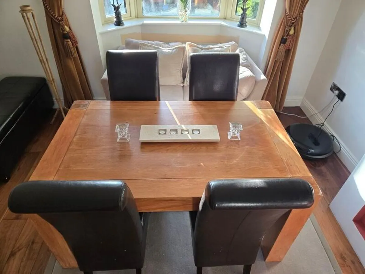 Solid Oak dining table and chairs - Image 1
