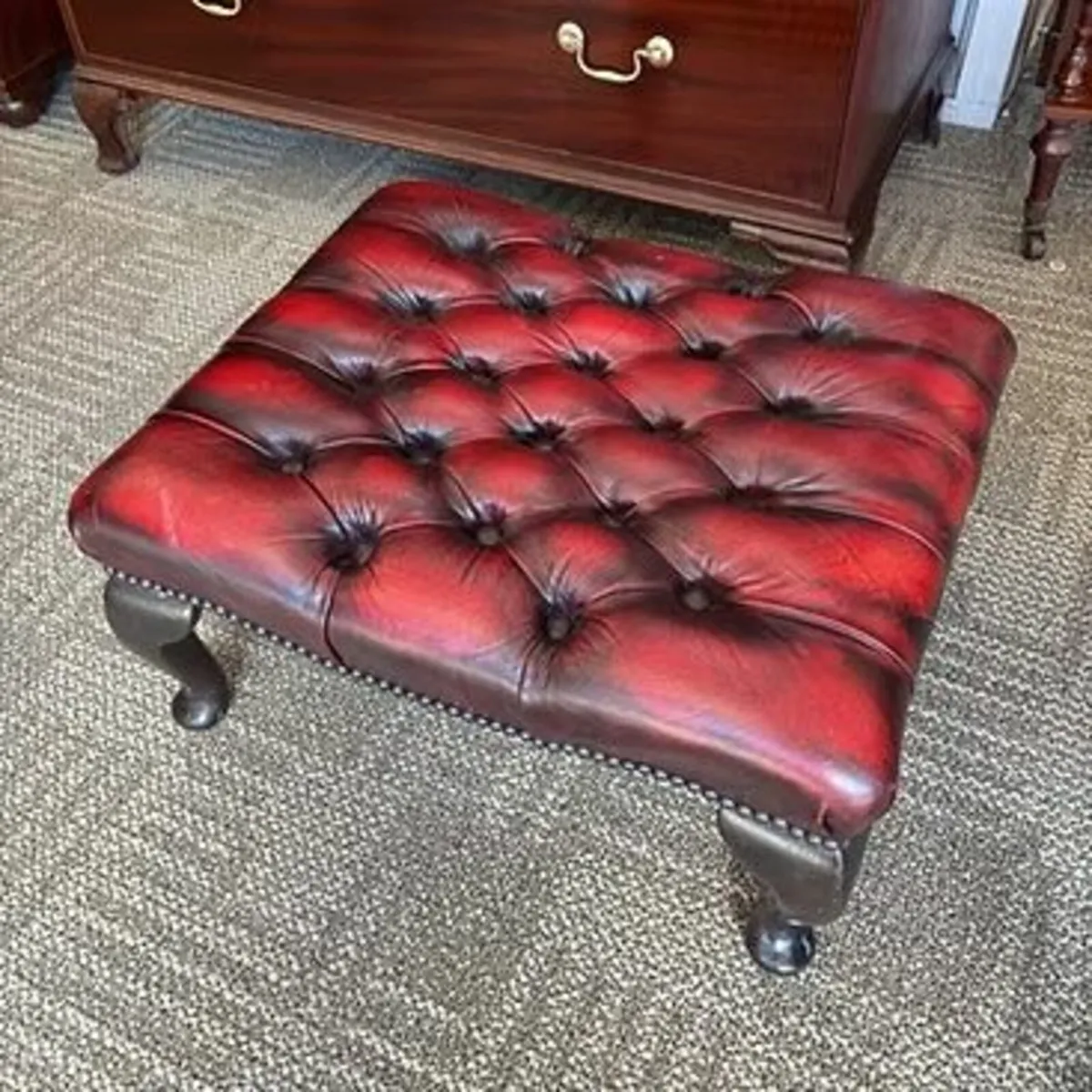 Fabulous deep red leather buttoned footstool