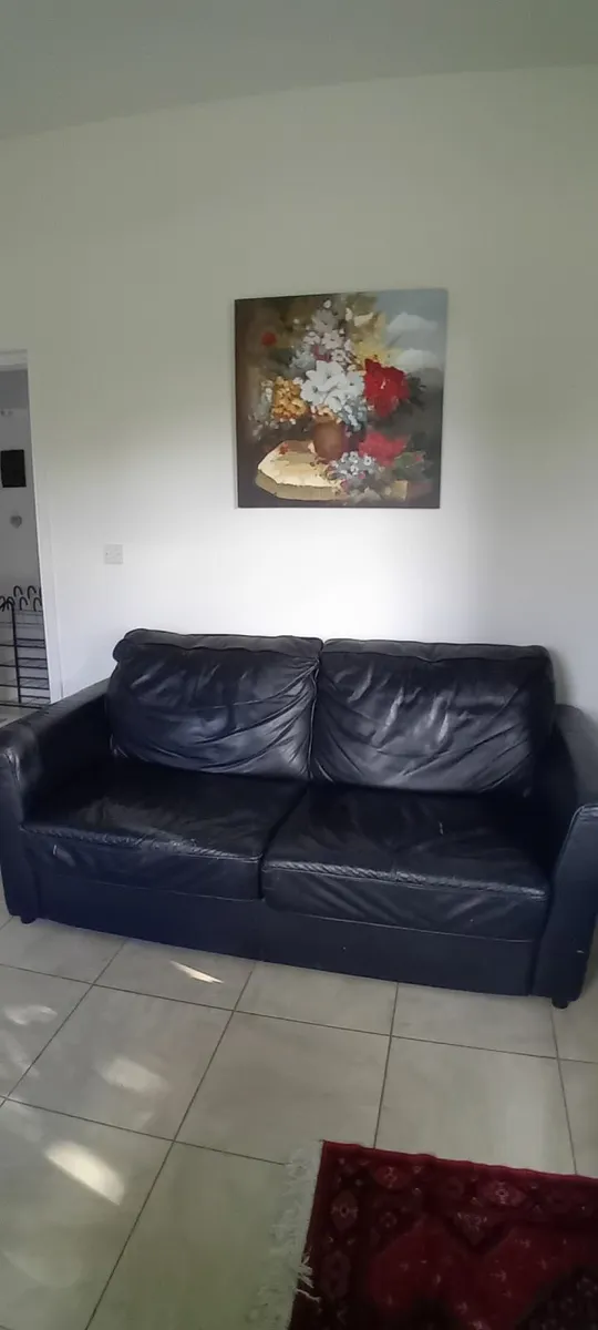 Black leather sofa bed - Image 1