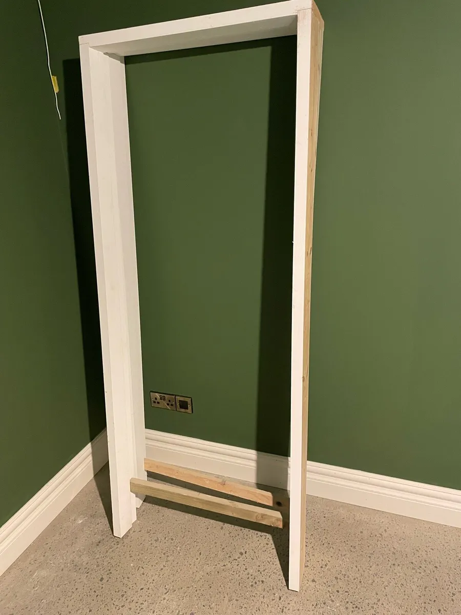 Two primed unused door frames - Image 1