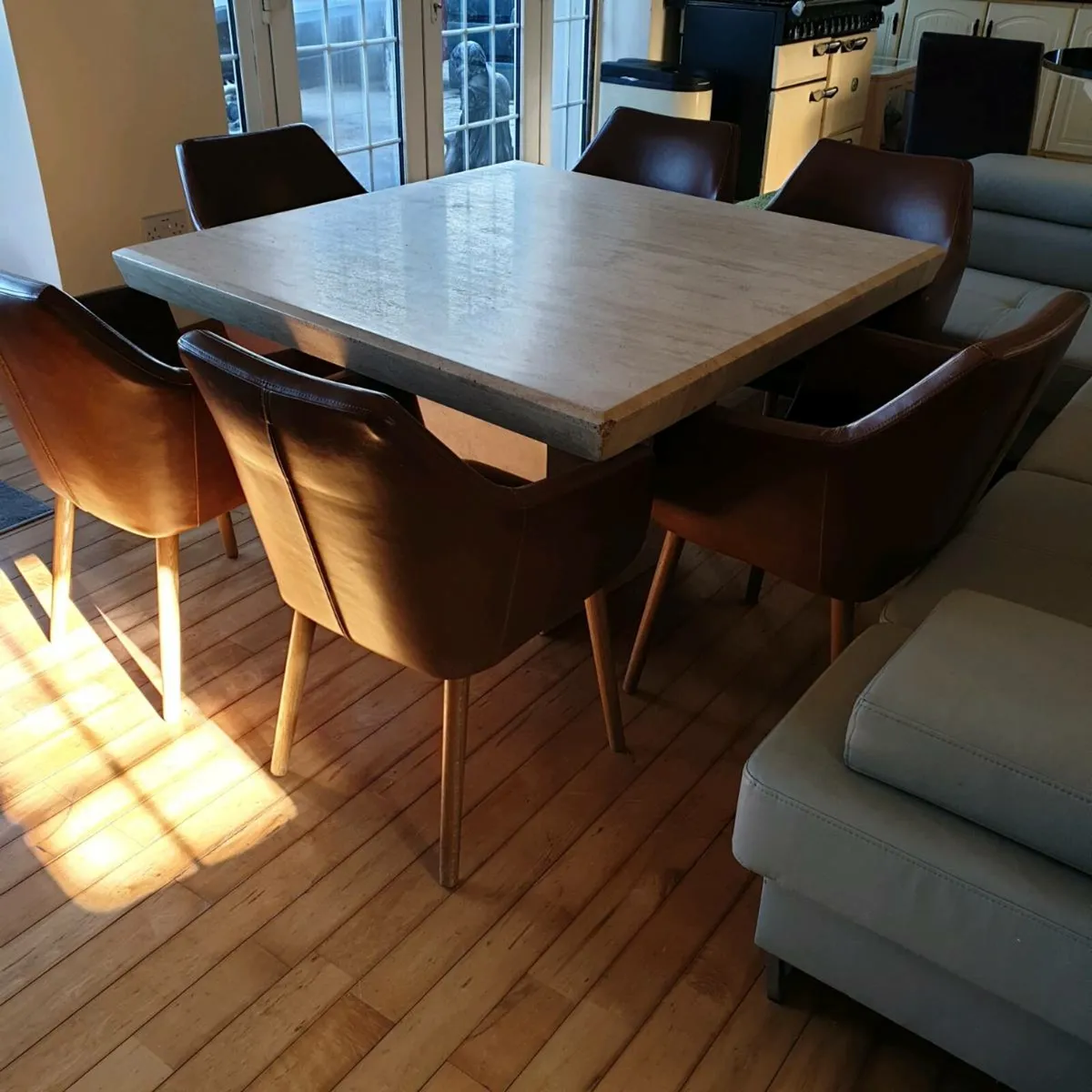 Cream marble table and 6 leather chairs - Image 1