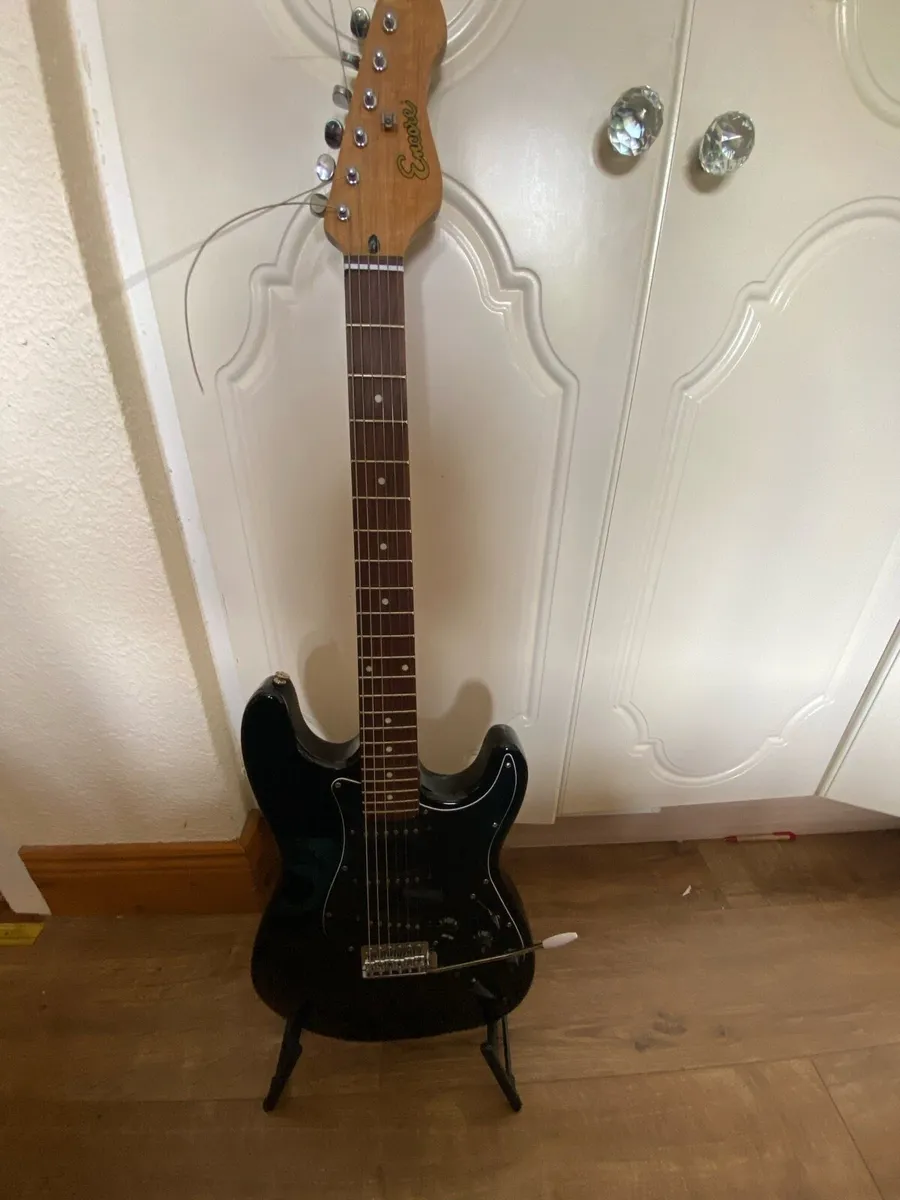 Encore electric guitar with stand and guitar tuner - Image 1