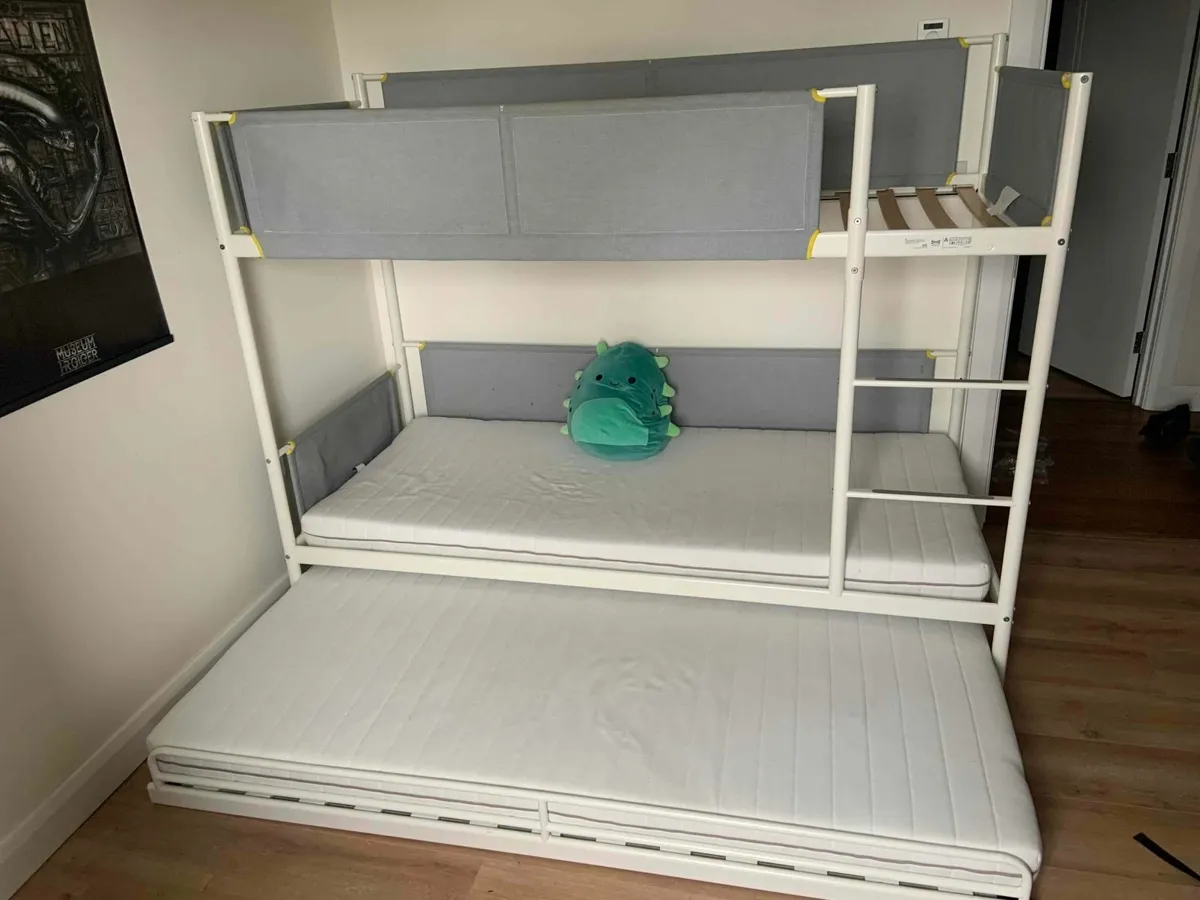 1 triple bunk bed and 1 twin stackable bed - Image 1
