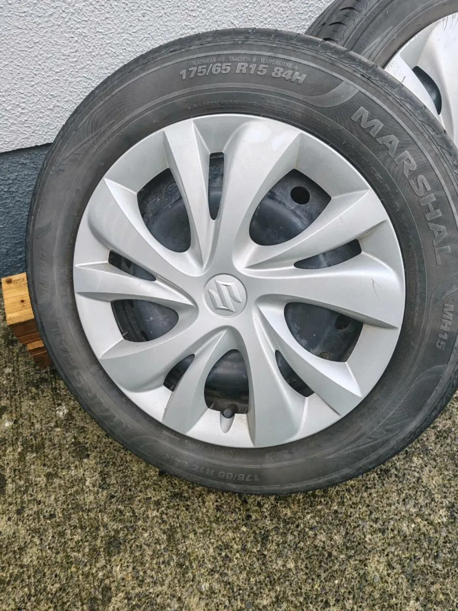 Suzuki swift steel rims with tires and hub caps - Image 2