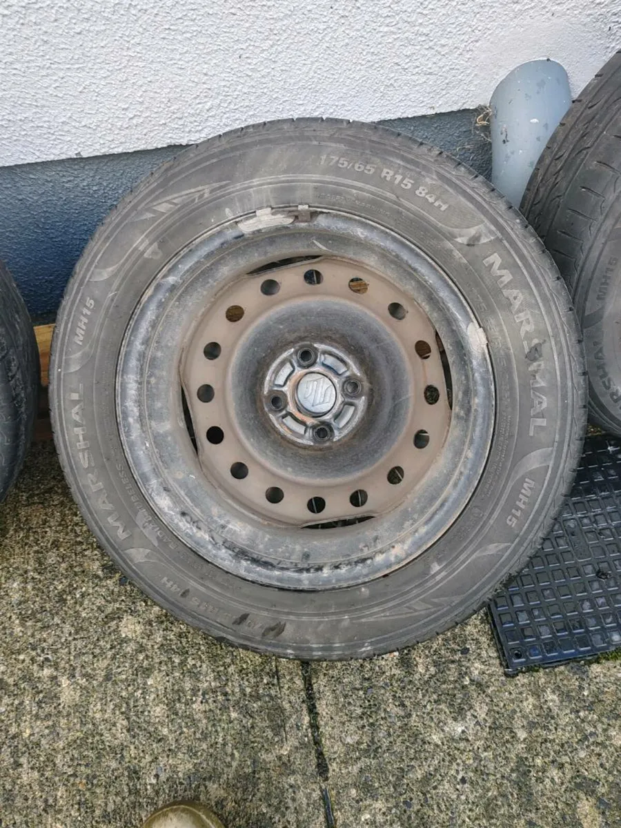 Suzuki swift steel rims with tires and hub caps - Image 3