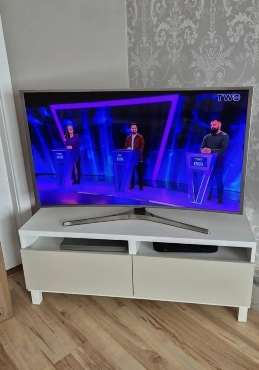 Samsung Smart TV and TV Stand - Image 1