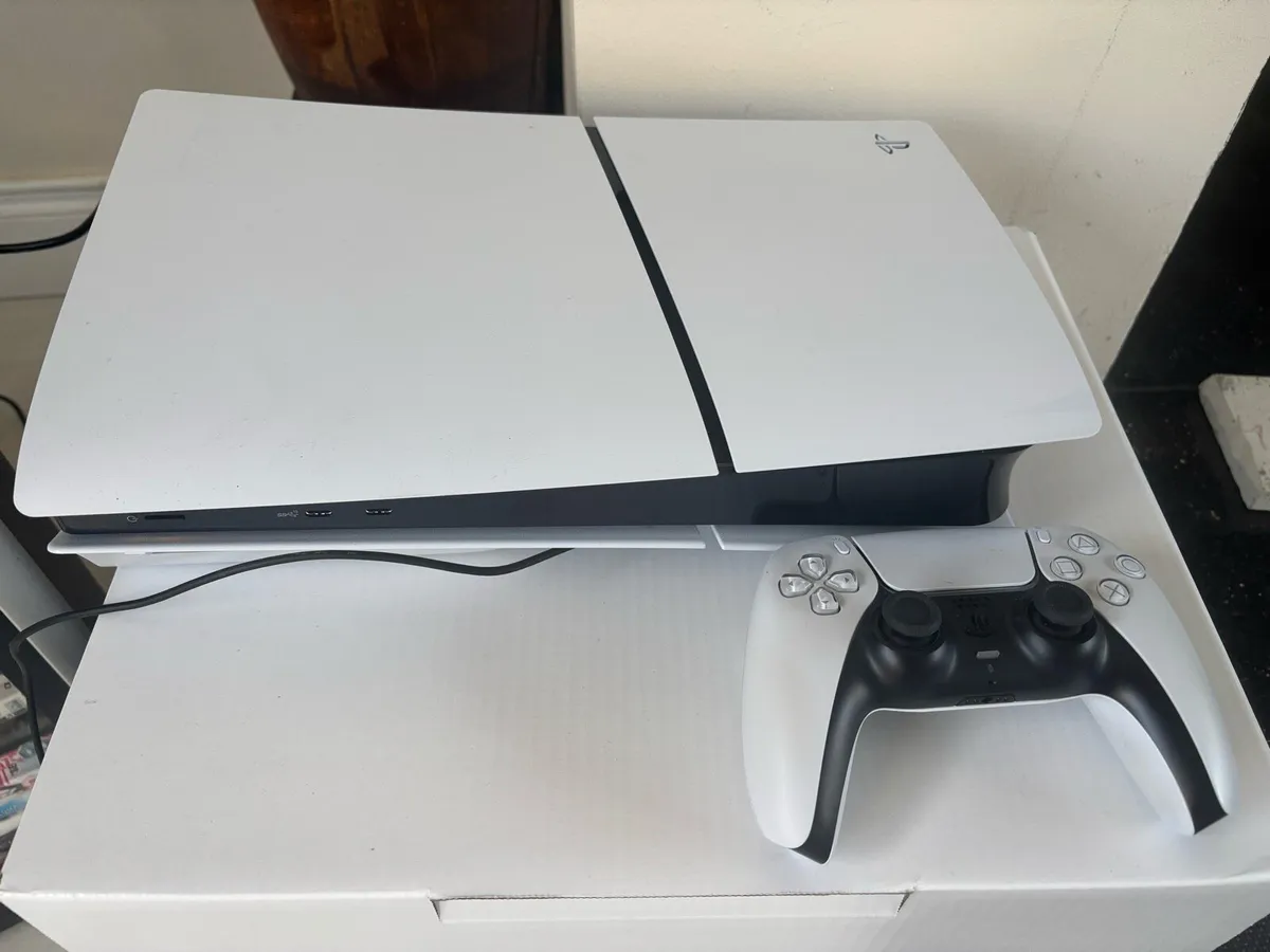 PlayStation 5 with 2 games.