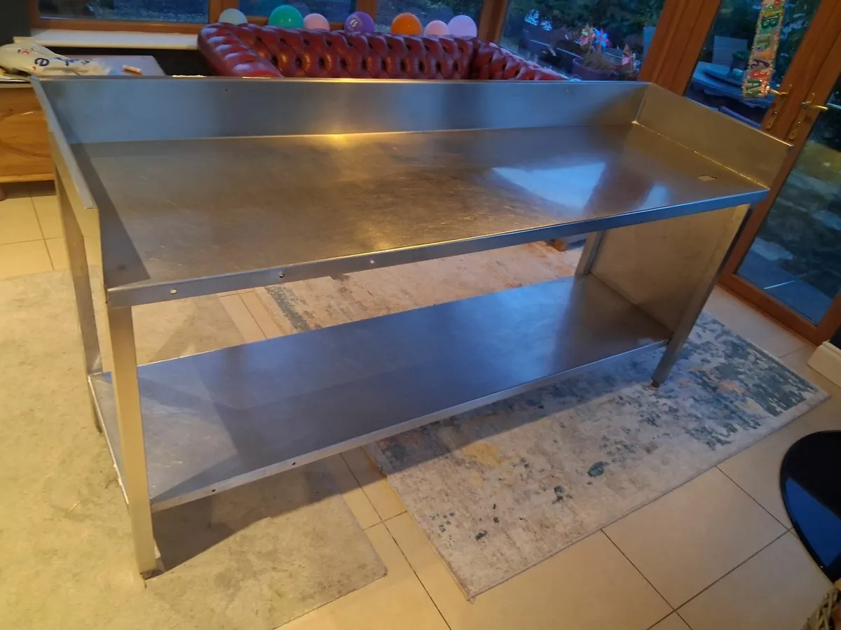 Stainless steel commercial table with upstand - Image 1