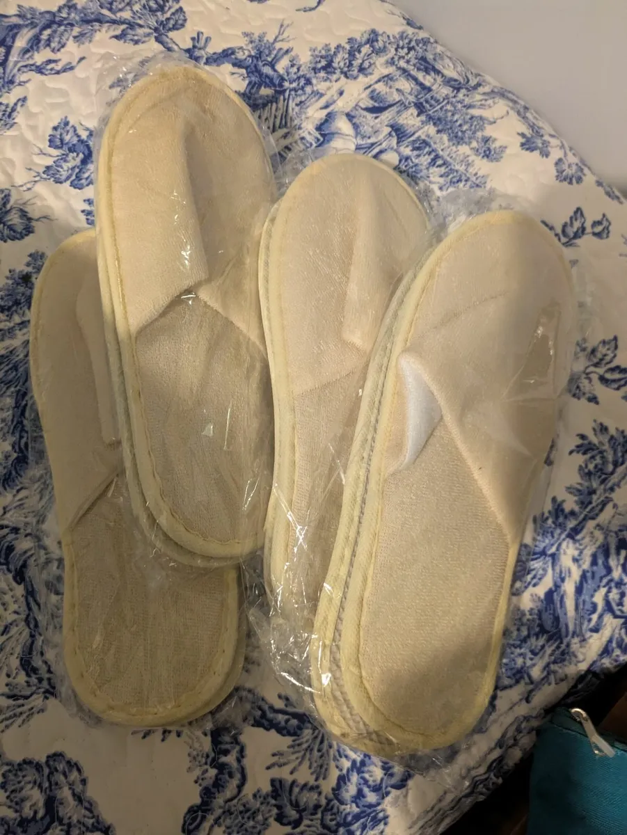 Free new disposable slippers for guests