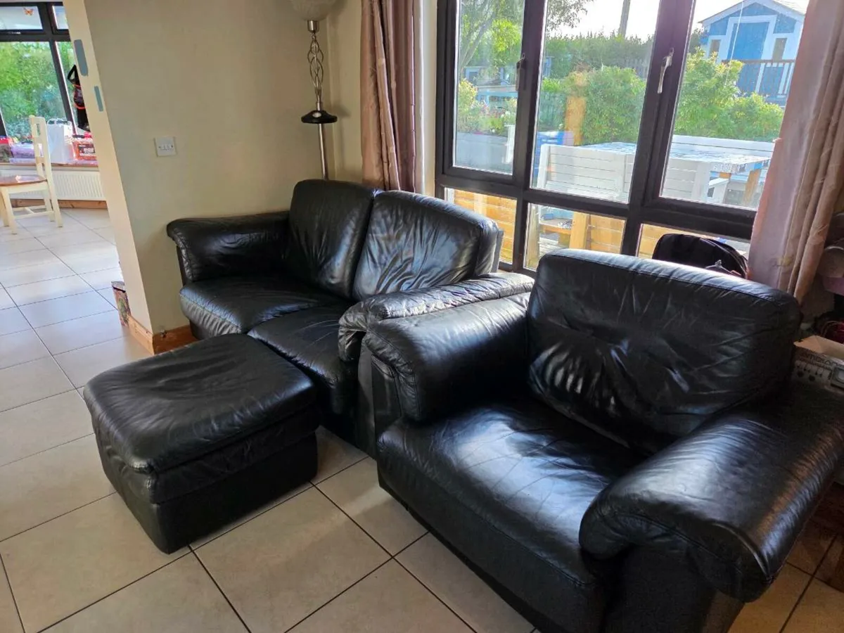 Black Leather 2 piece suite and Footrest- DFS - Image 1