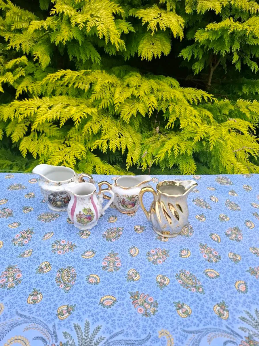 4 china milk jugs postage possible