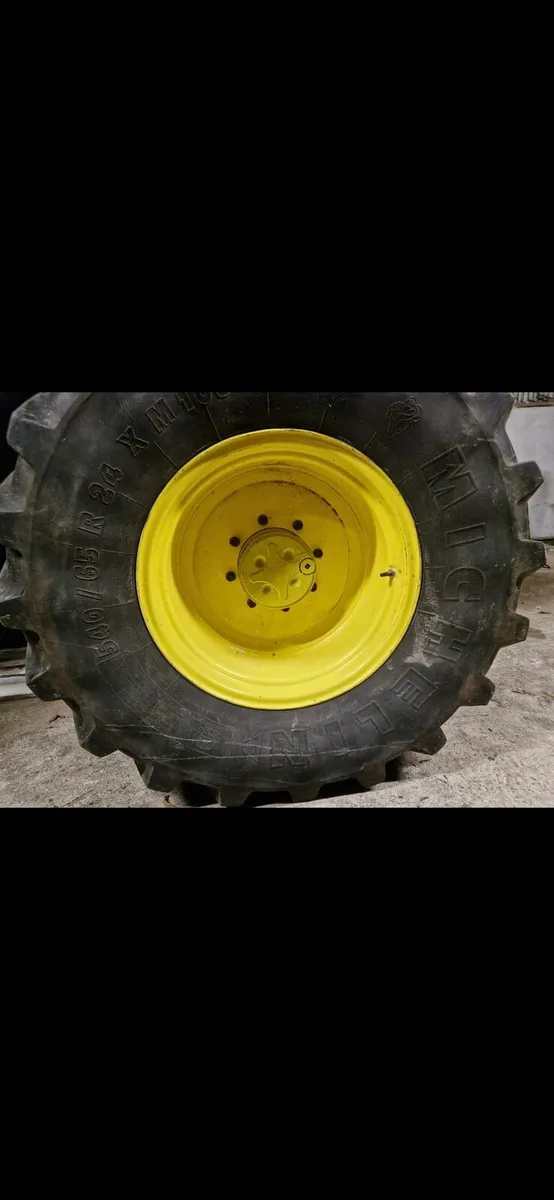 John deere  24"front rims / weights - Image 1