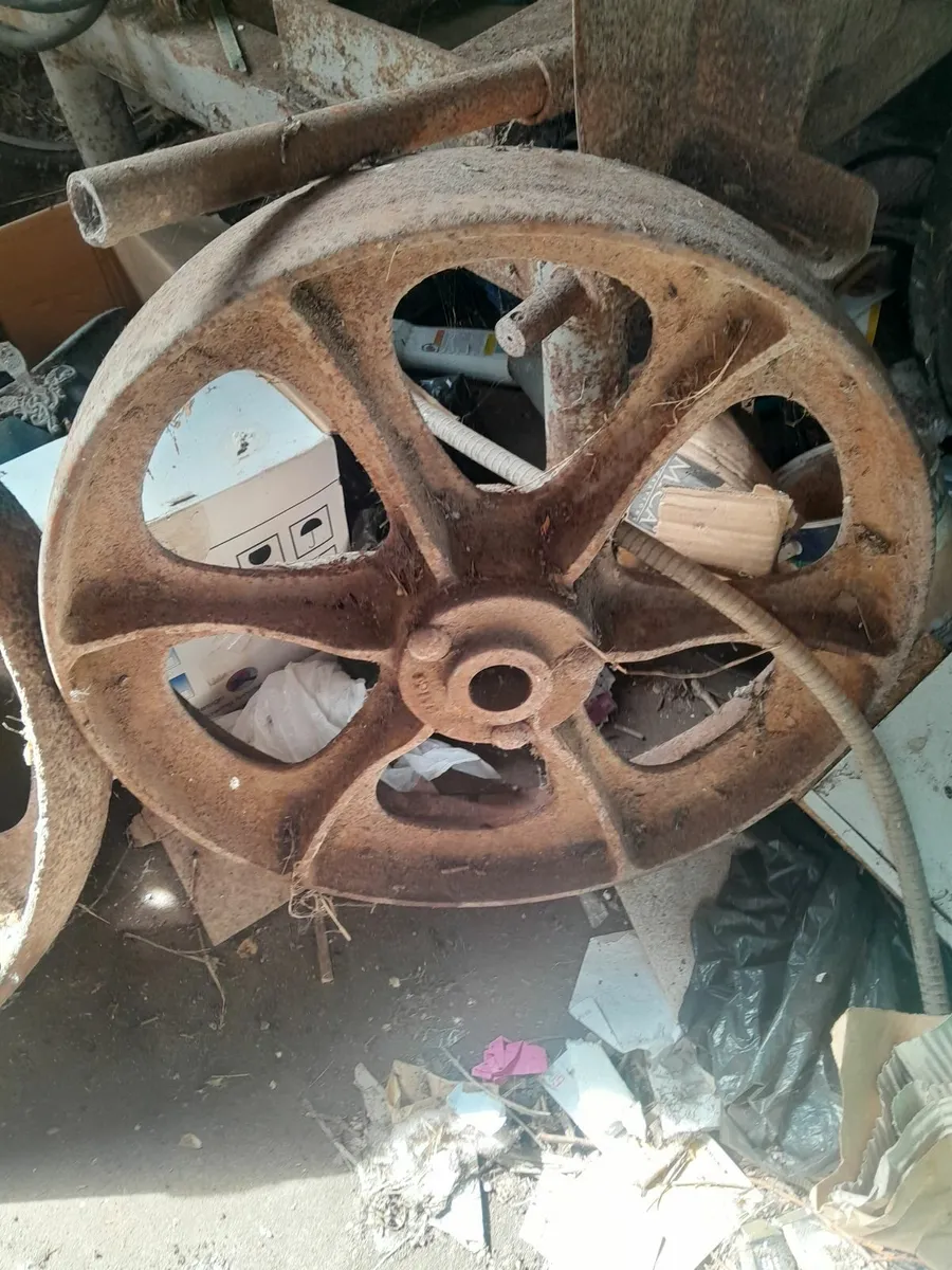 Two vintage cast iron  wheels - Image 1