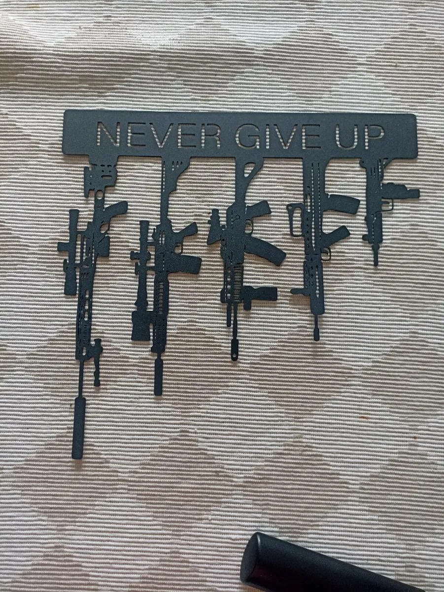 Metal  machine gun wall sign