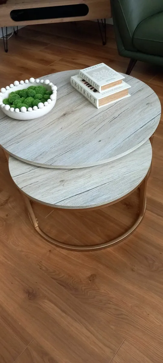 A pair of low circular coffee tables