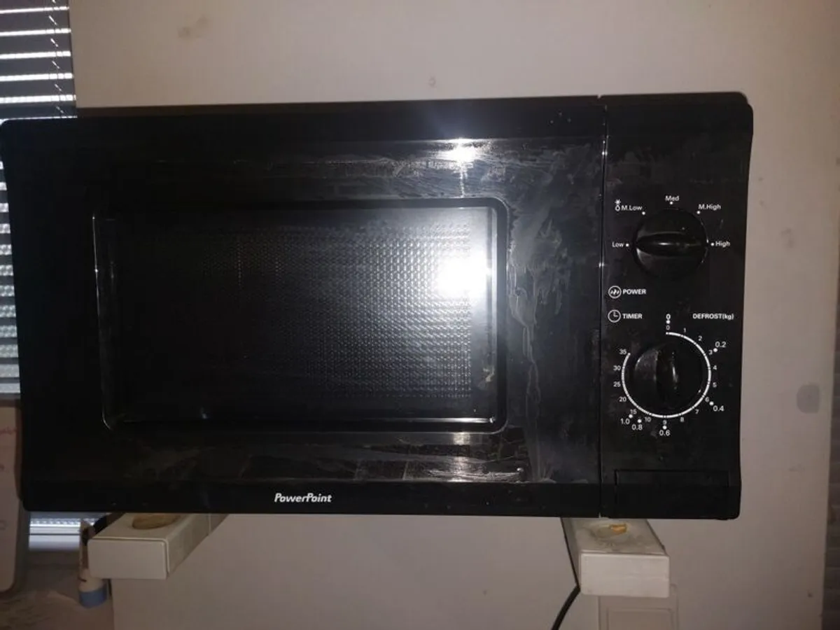 black microwave 17inc length 9and a half inc width - Image 1