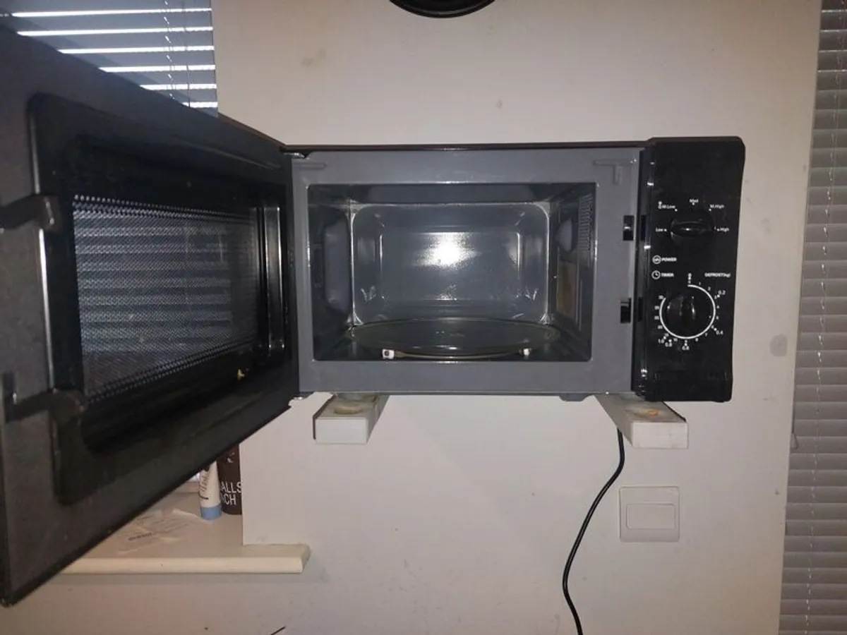 black microwave 17inc length 9and a half inc width - Image 2